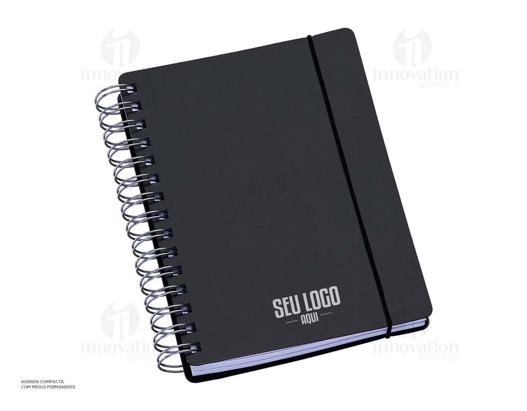 Agenda compacta com acabamento Wire-o, elástico na cor azul e peso de 63g.