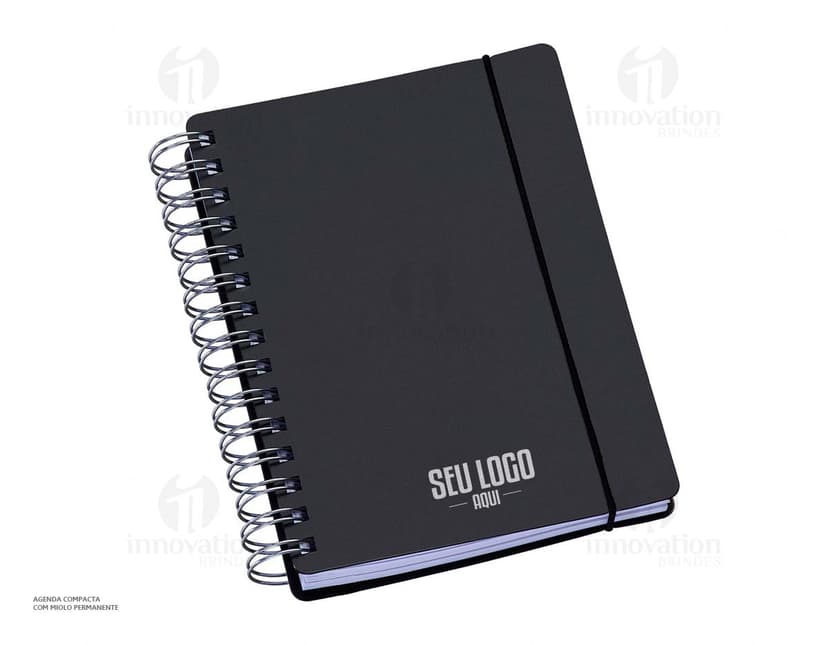 Agenda compacta com acabamento Wire-o, elástico na cor azul e peso de 63g.