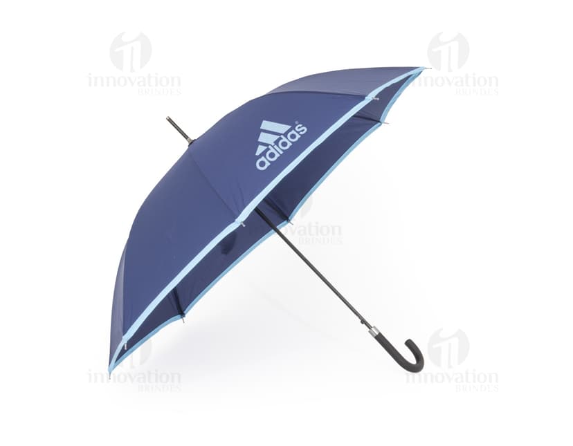 Guarda-chuva manual em poliéster com aço, design colorido em laranja e amarelo, com uma combinação de cores vibrantes. Possui uma forma única de guarda-sol com detalhes em 3D, apresentando elementos gráficos e símbolos, como um peixe-espada e uma fita arco-íris. O guarda-chuva é decorado com padrões modernos e uma asa de guarda-chuva com marcações de segurança. É um acessório ideal para proteção contra chuva e sol durante o verão, adequado para uso de pescadores, surfistas e para decoração em vários ambientes.
