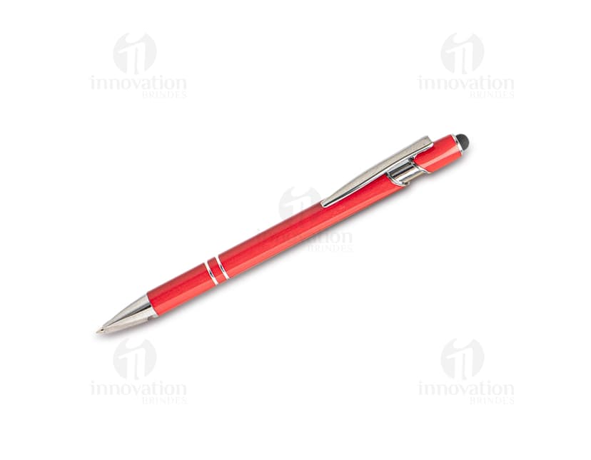 Caneta metal touch em diversas cores sobre uma mesa de escritório, ao lado de um bloco de notas, lápis e papel.