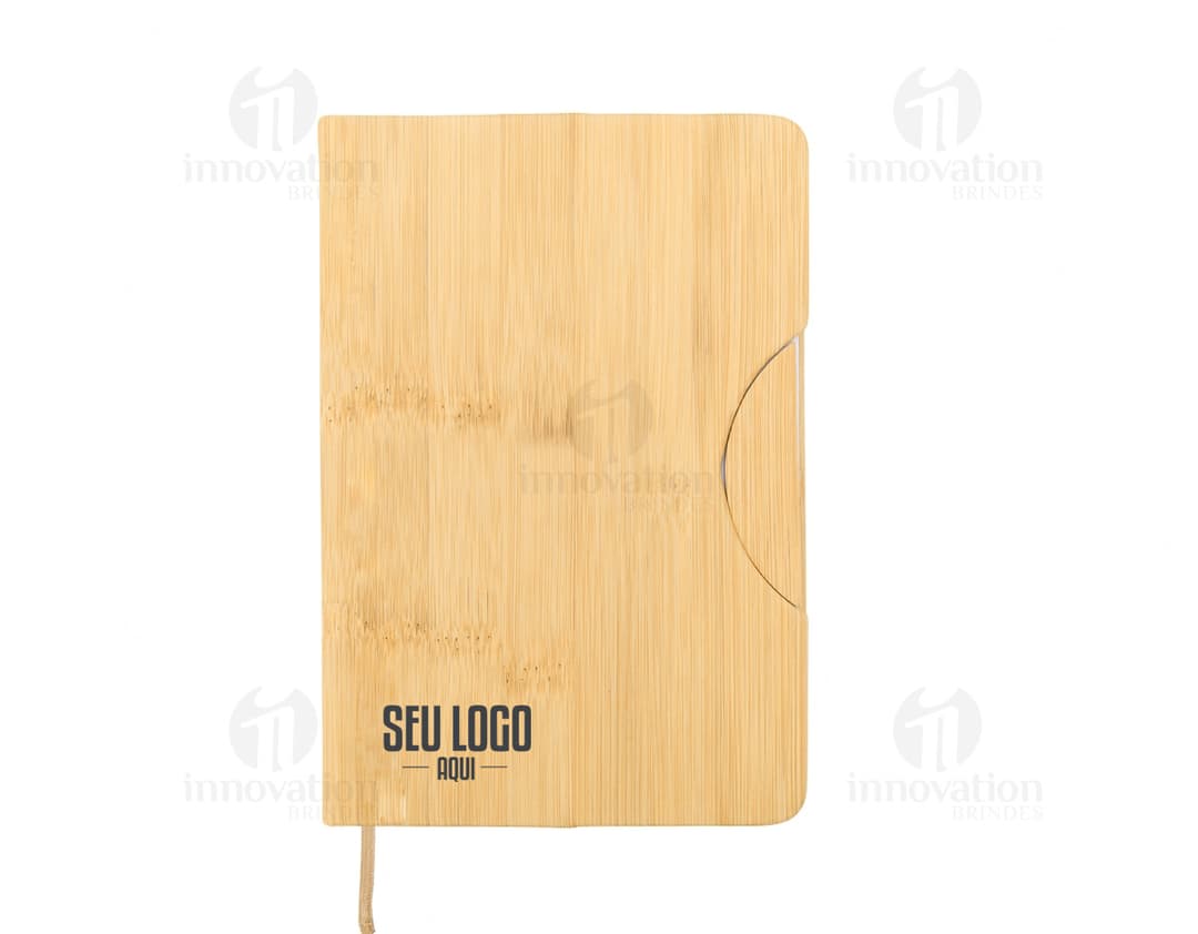 Caderneta com suporte para celular em cor rosa com elástico para prender o celular na capa frontal.