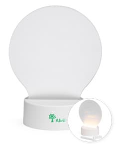 Luminária LED de mesa na cor branca, com braço flexível e base redonda.