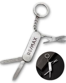 Chaveiro canivete 3 funções de metal prateado, com mecanismo de abrir e fechar, ideal para segurança e controle de acesso. Possui design elegante e acessório de estilo.